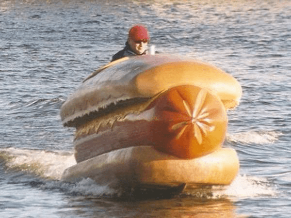 Phil Hellmuth Riding a Giant Hot Dog on Water